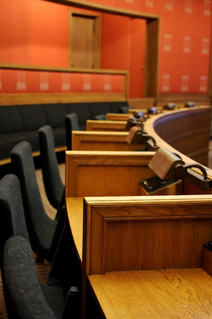 A tastefully designed conference hall featuring wooden seating and modern decor in Oslo, Norway.